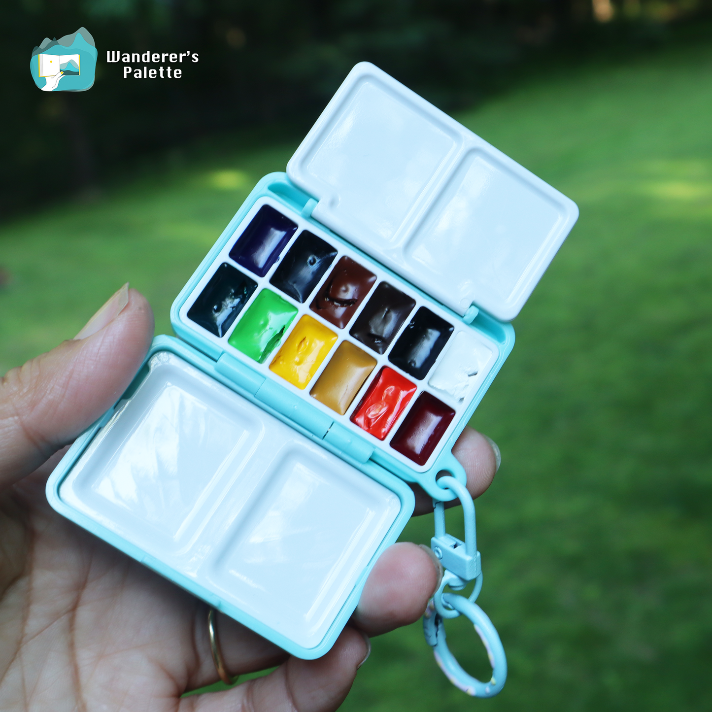 	Pos 4: Mini watercolor palette open showing 12 Holbein color pans