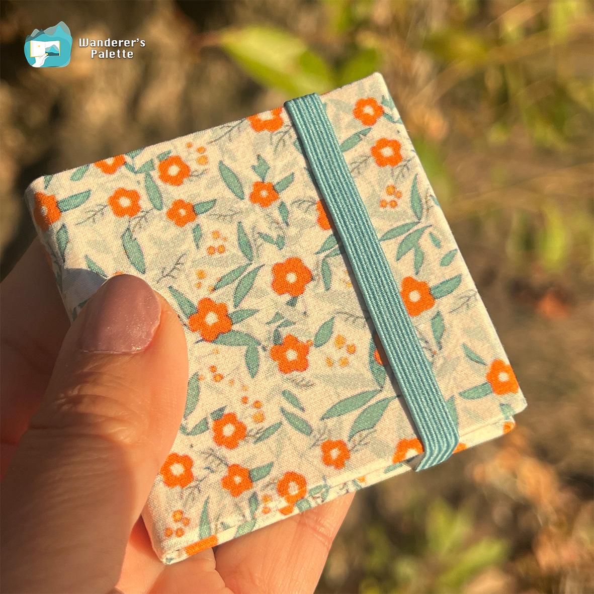 	Pos 8: Mini watercolor journal in hand - 2.4x2.4 pocket sketchbook