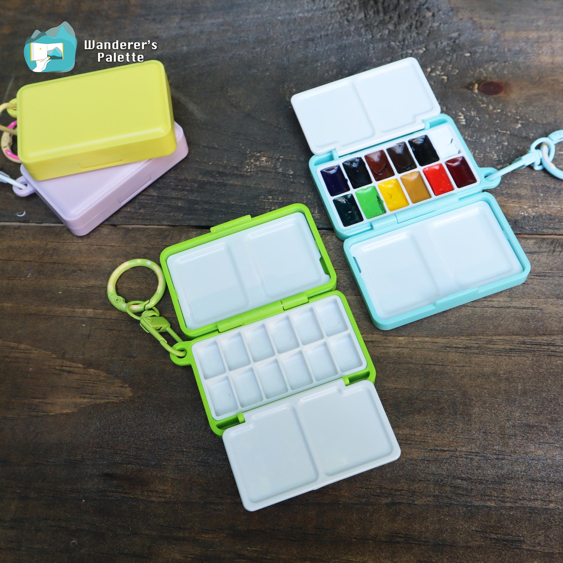 	Pos 4: Mini watercolor palette open showing 12 Holbein color pans