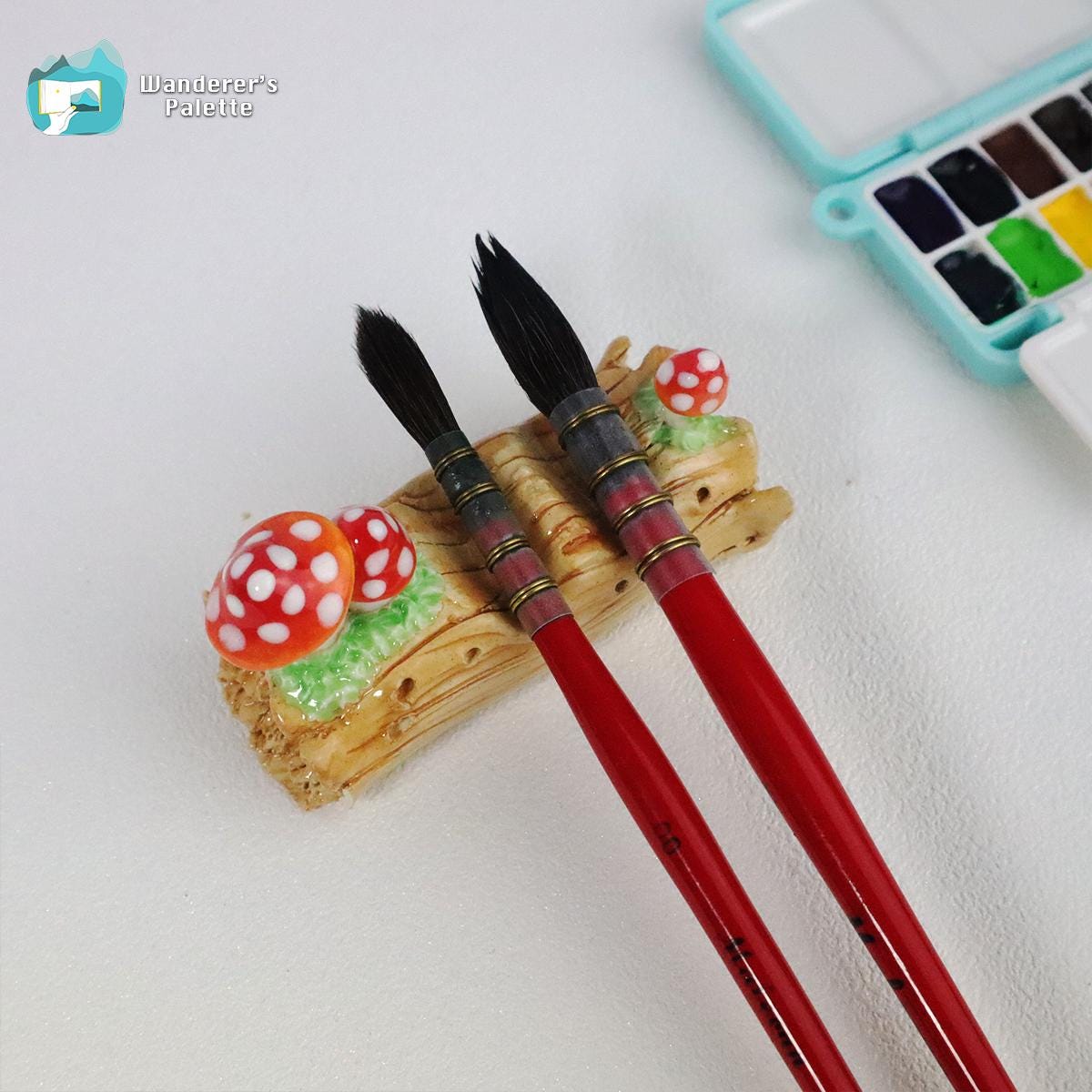 Pos 2: Mushroom ceramic brush rest close-up - handmade artist brush holder