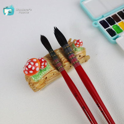 Pos 2: Mushroom ceramic brush rest close-up - handmade artist brush holder