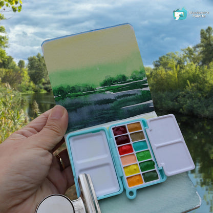 	Pos 3: Artist painting with mini watercolor palette - travel art kit