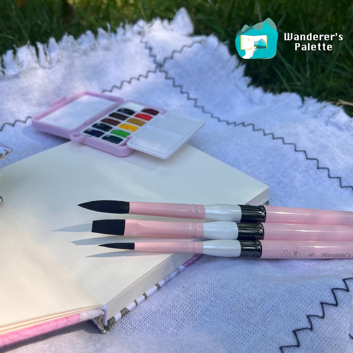 	Pos 3: Artist painting with pink collapsible watercolor brush