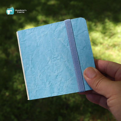 	Pos 8: Cotton watercolor journal in hand - 4x4 travel sketchbook